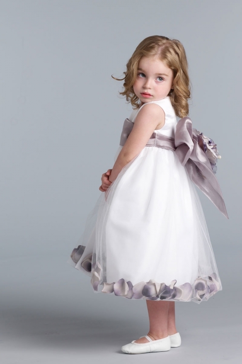 flower girl dress with flower petals in the skirt